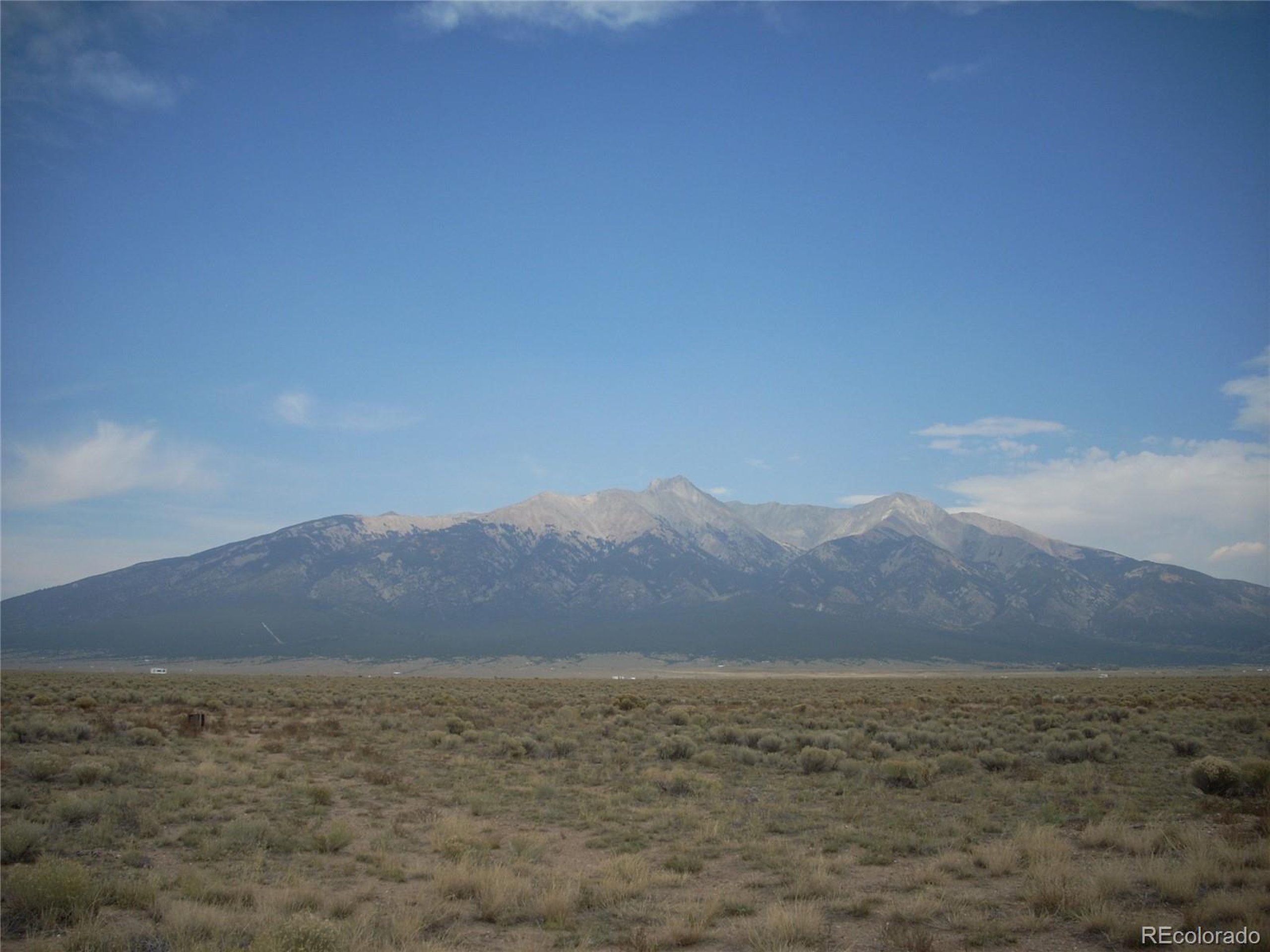 a view of ocean and mountains