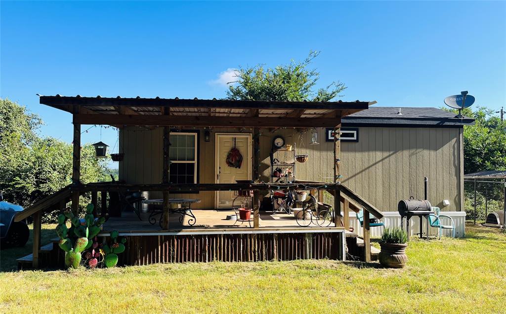 a view of house with outdoor space and swimming pool