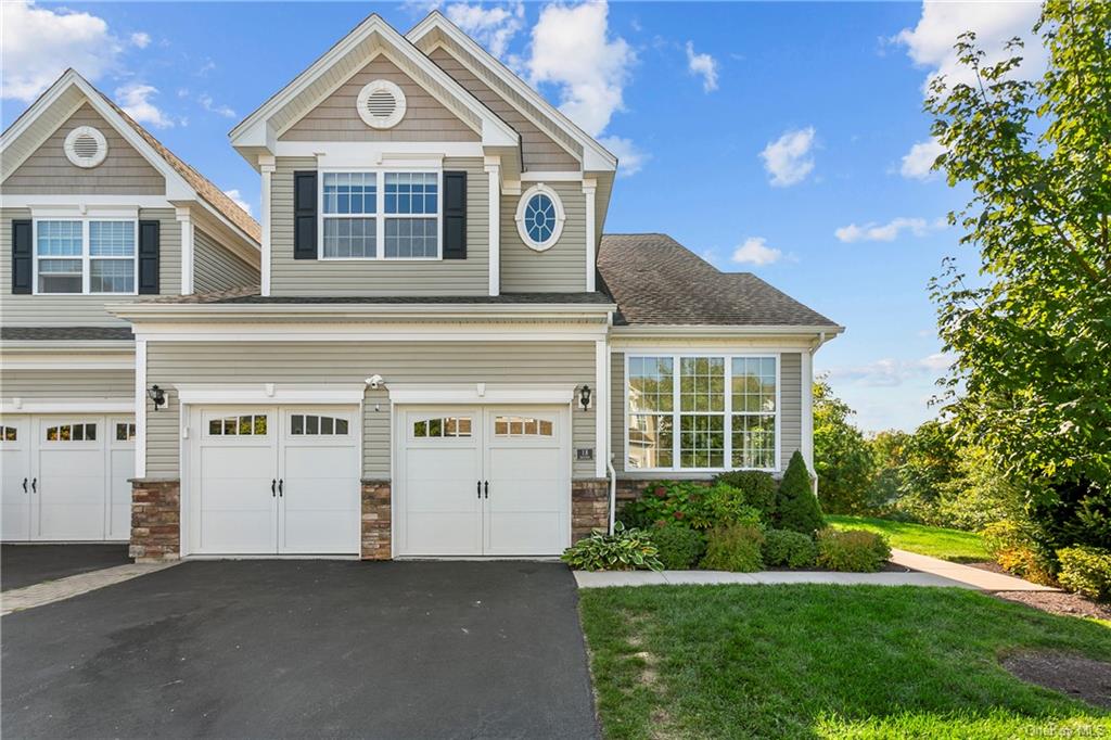 Gorgeous corner unit with 2 car garage