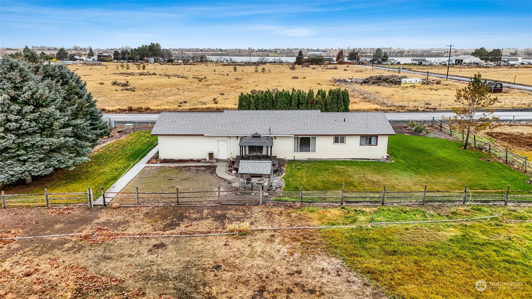 an aerial view of residential houses with outdoor space