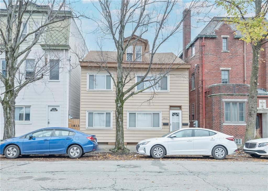 a car parked in front of a house