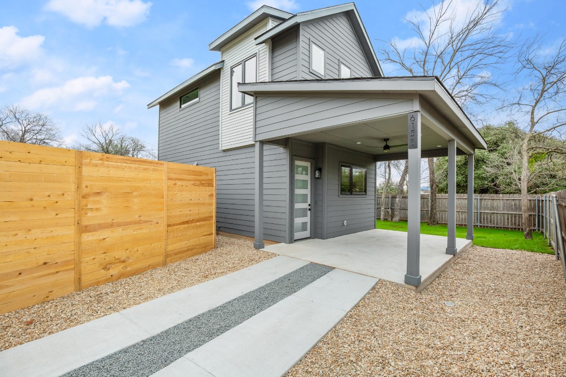 a view of a house with a backyard