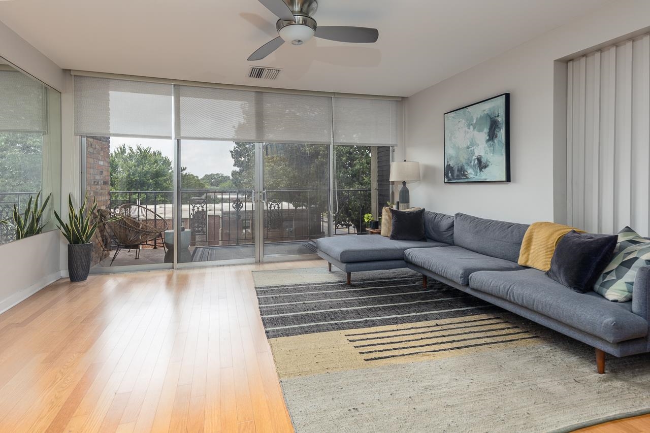 a living room with furniture and a rug