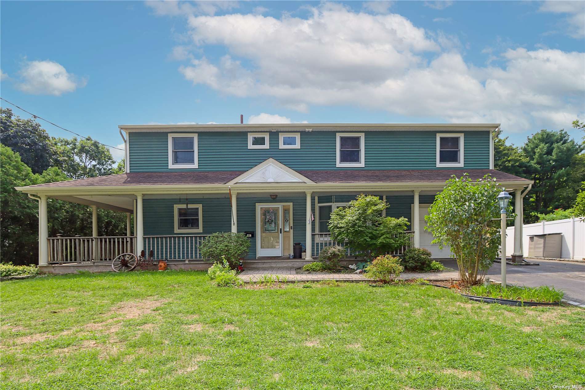 front view of a house with a yard