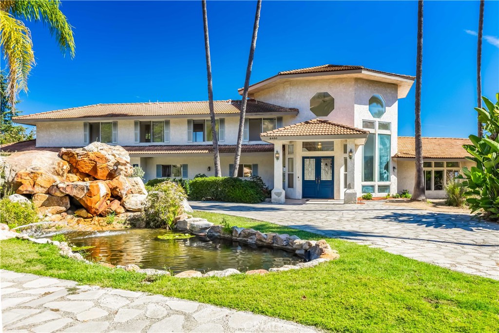 a front view of a house with swimming pool