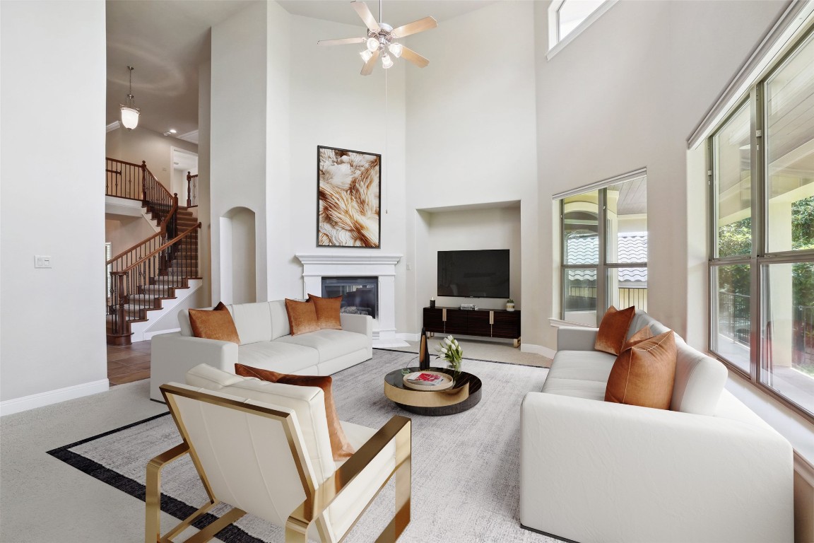 a living room with fireplace furniture and a flat screen tv