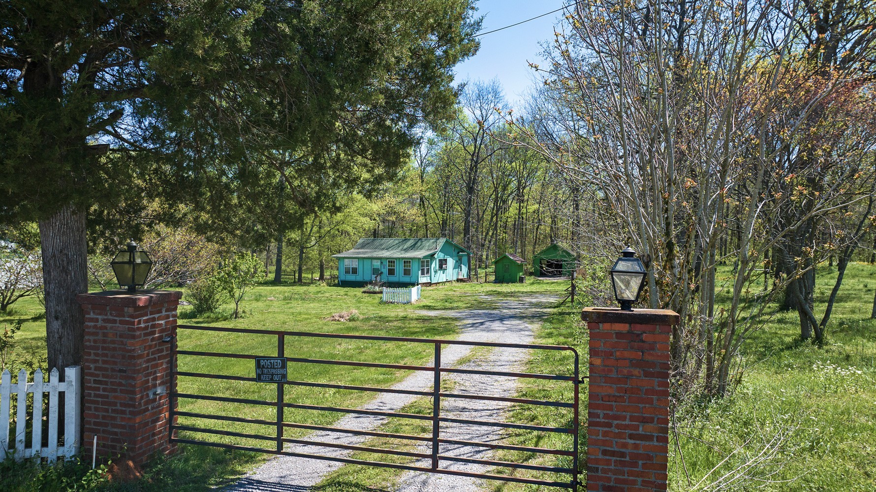 a view of a wooden fence and trees