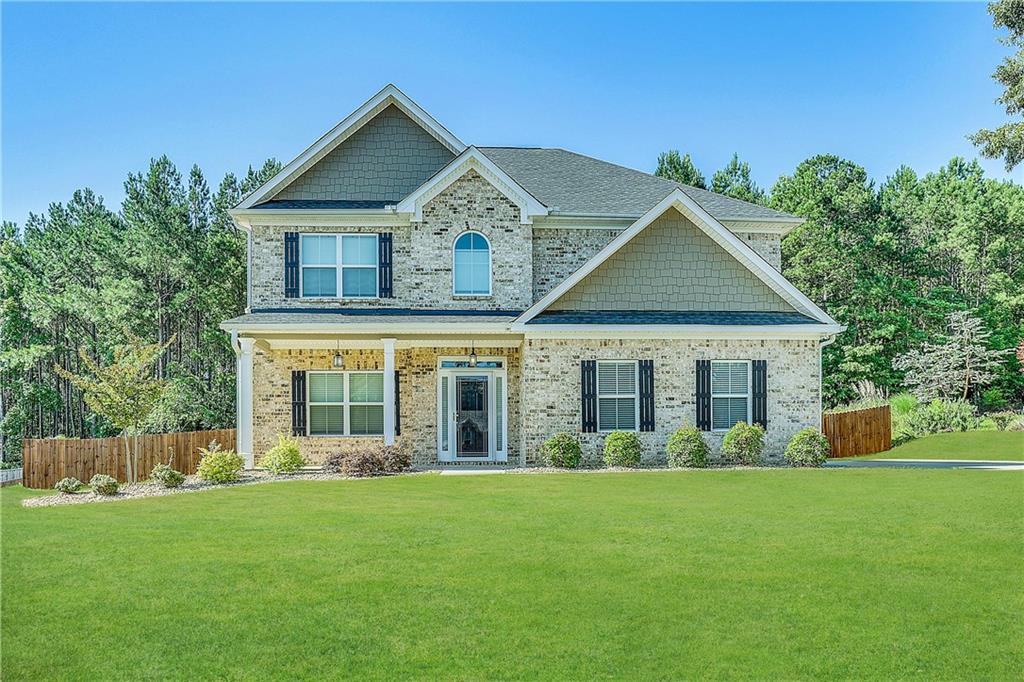 front view of a house with a yard