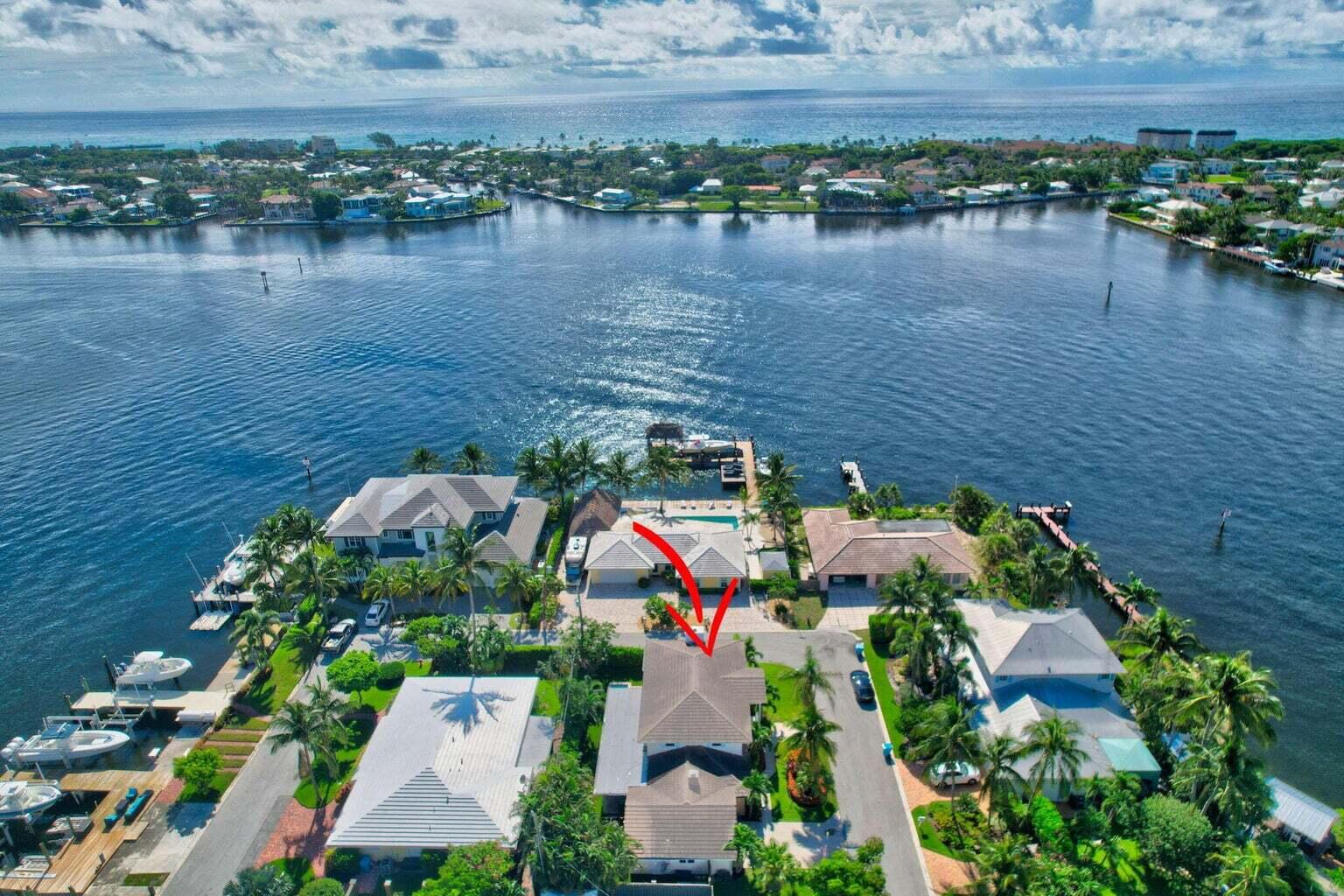 an aerial view of residential house with outdoor space and lake view