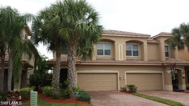 a front view of a house with a garage