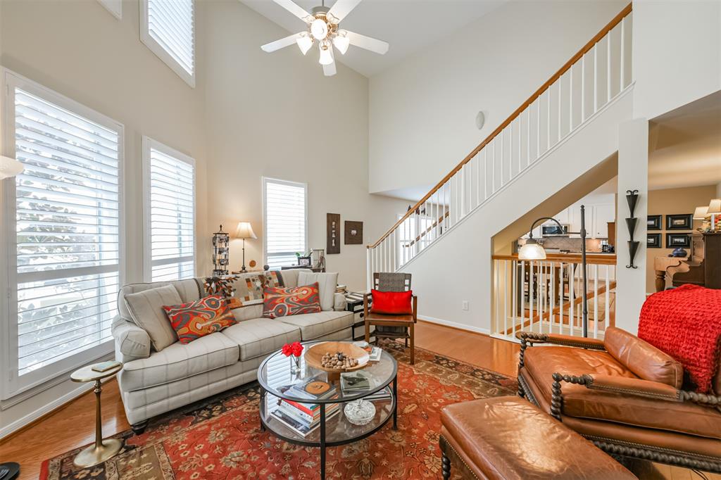 This two story living area is light and bright and is tucked amongst the trees. You will love the privacy and airy feeling of this space. Very rare floorplan for this area! Notice the HARDWOOD FLOORS & PLANTATION SHUTTERS.