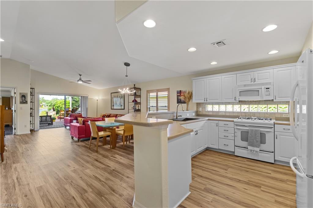 a kitchen with stove and cabinets