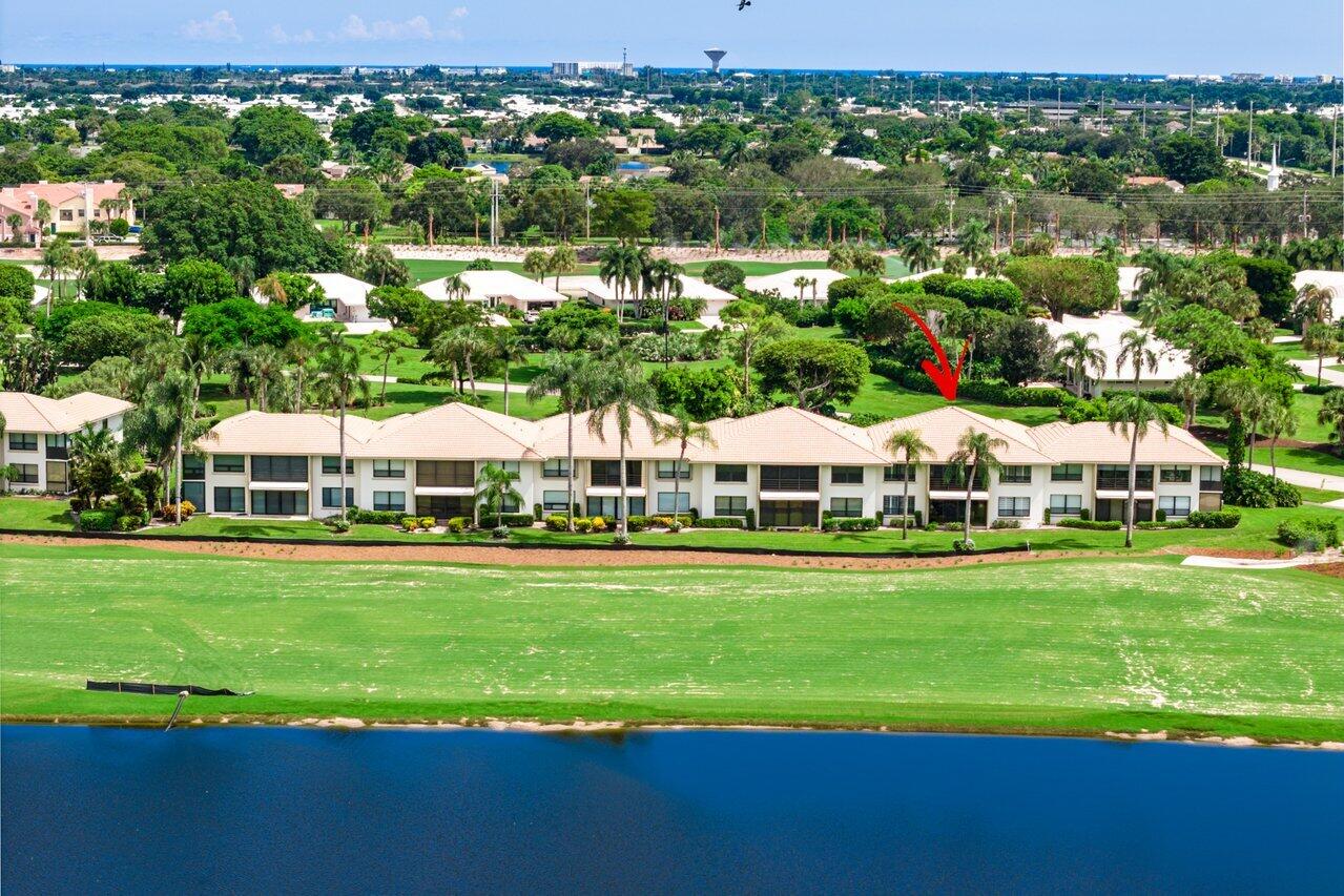 a view of a big yard with a house in the background