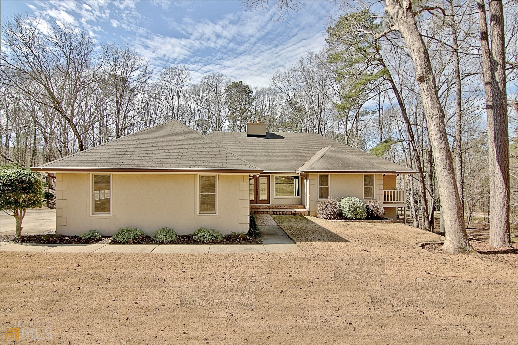 a front view of a house with a yard