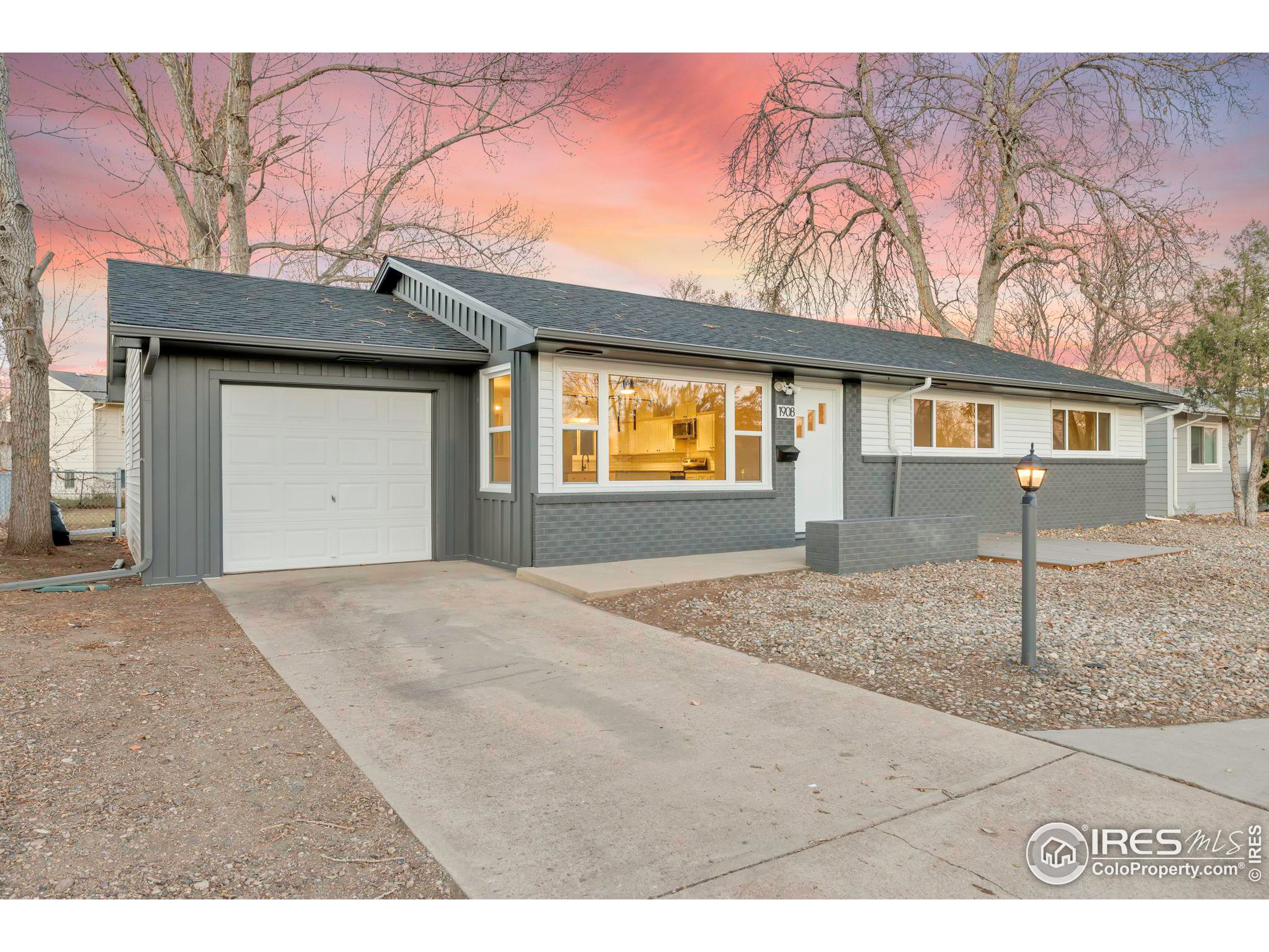 a front view of a house with a space and garage