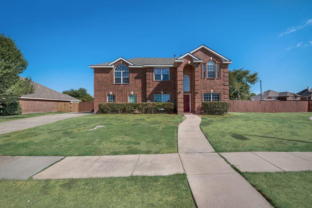 a front view of house with yard