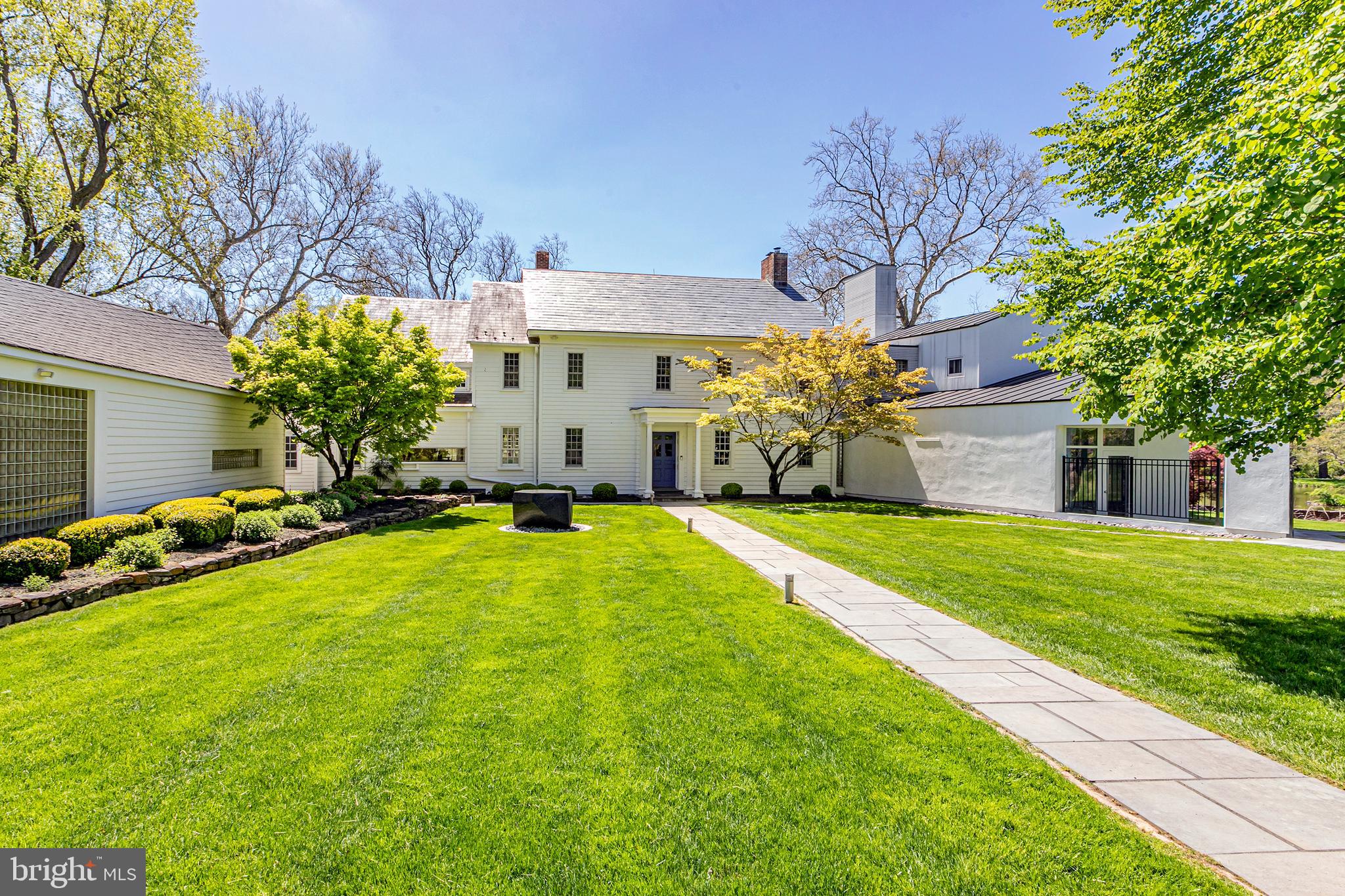 a front view of a house with swimming pool yard and outdoor seating