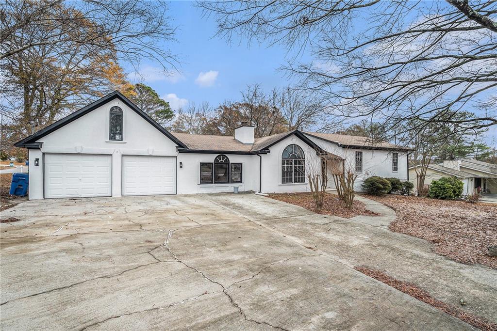 a view of a house with a snow in the yard