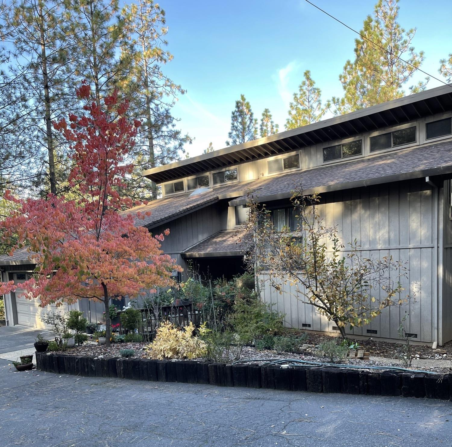 Note the clerestory passive solar windows in this view.  The landscaping is designed for year round color.  The original plan was by landscape architect Ray Yamasaki.  The original building plans and landscape plans will be left for the buyer.