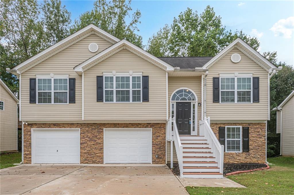 a front view of a house with a garage