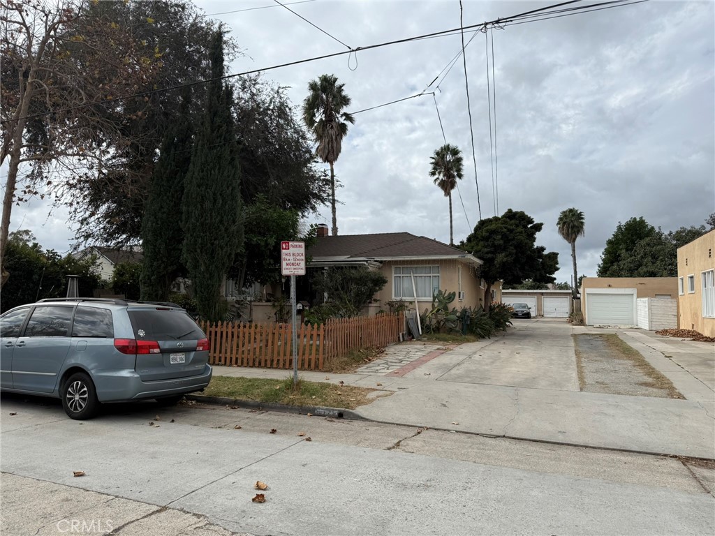 a view of a car parked in front of a house