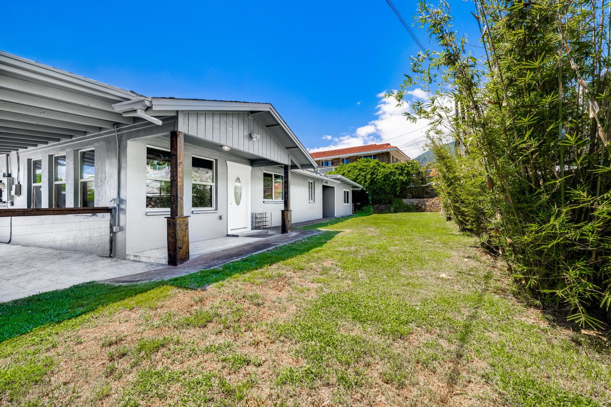 a front view of a house with a yard and porch