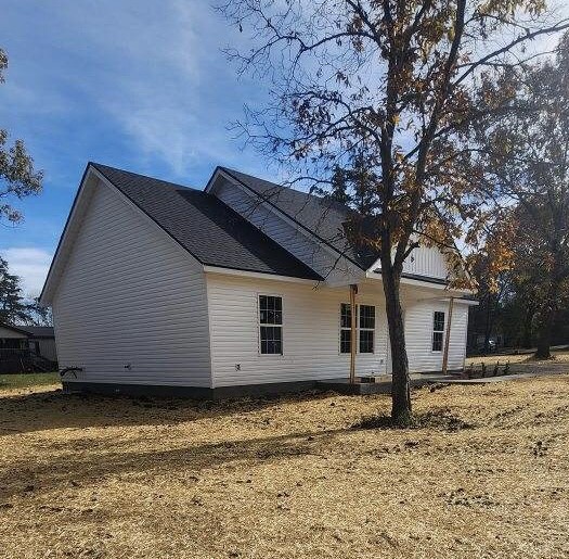 a house with a tree in front of it