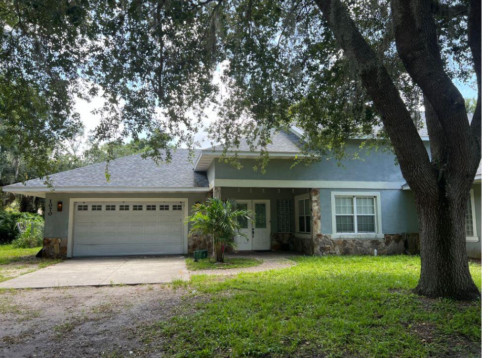 front view of a house with a yard