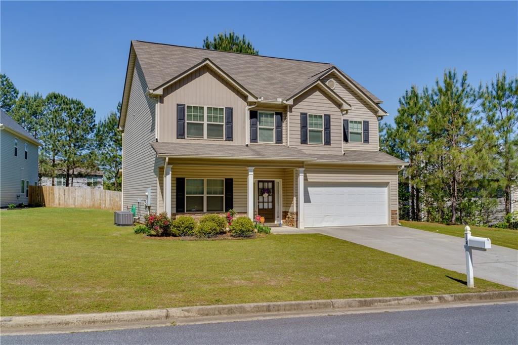 a front view of a house with a yard