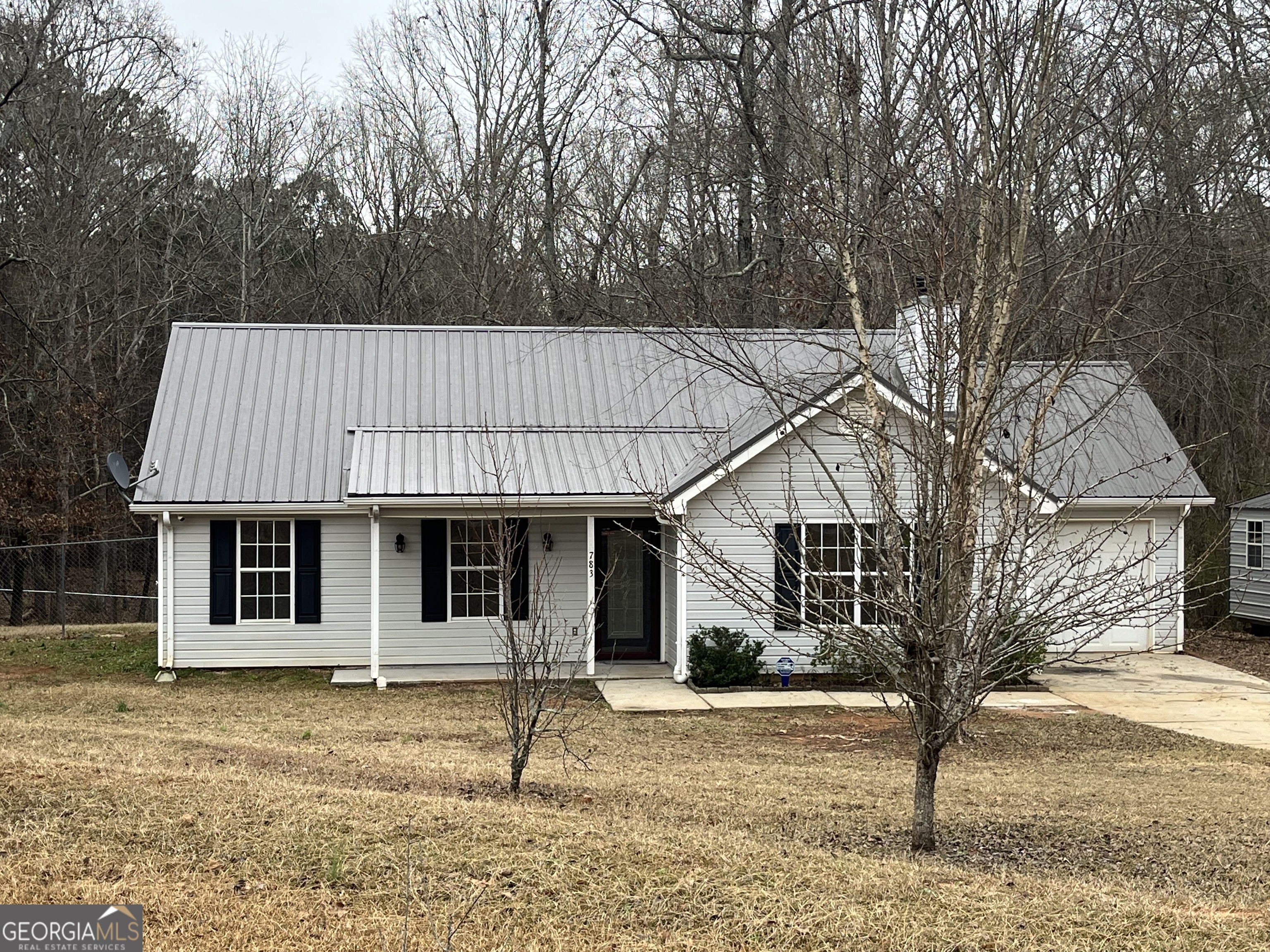 a house with trees in the background