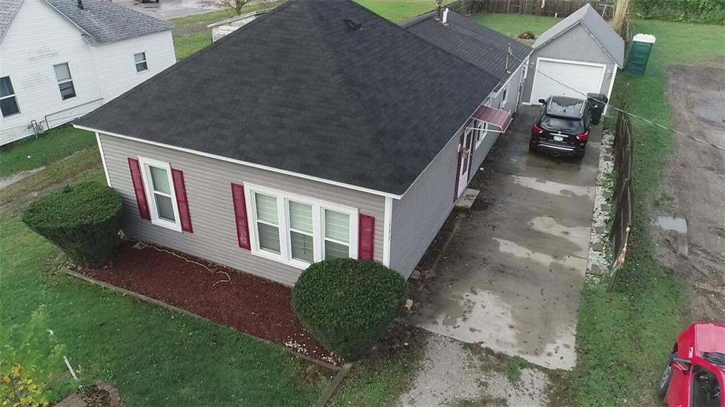 a aerial view of a house with a yard