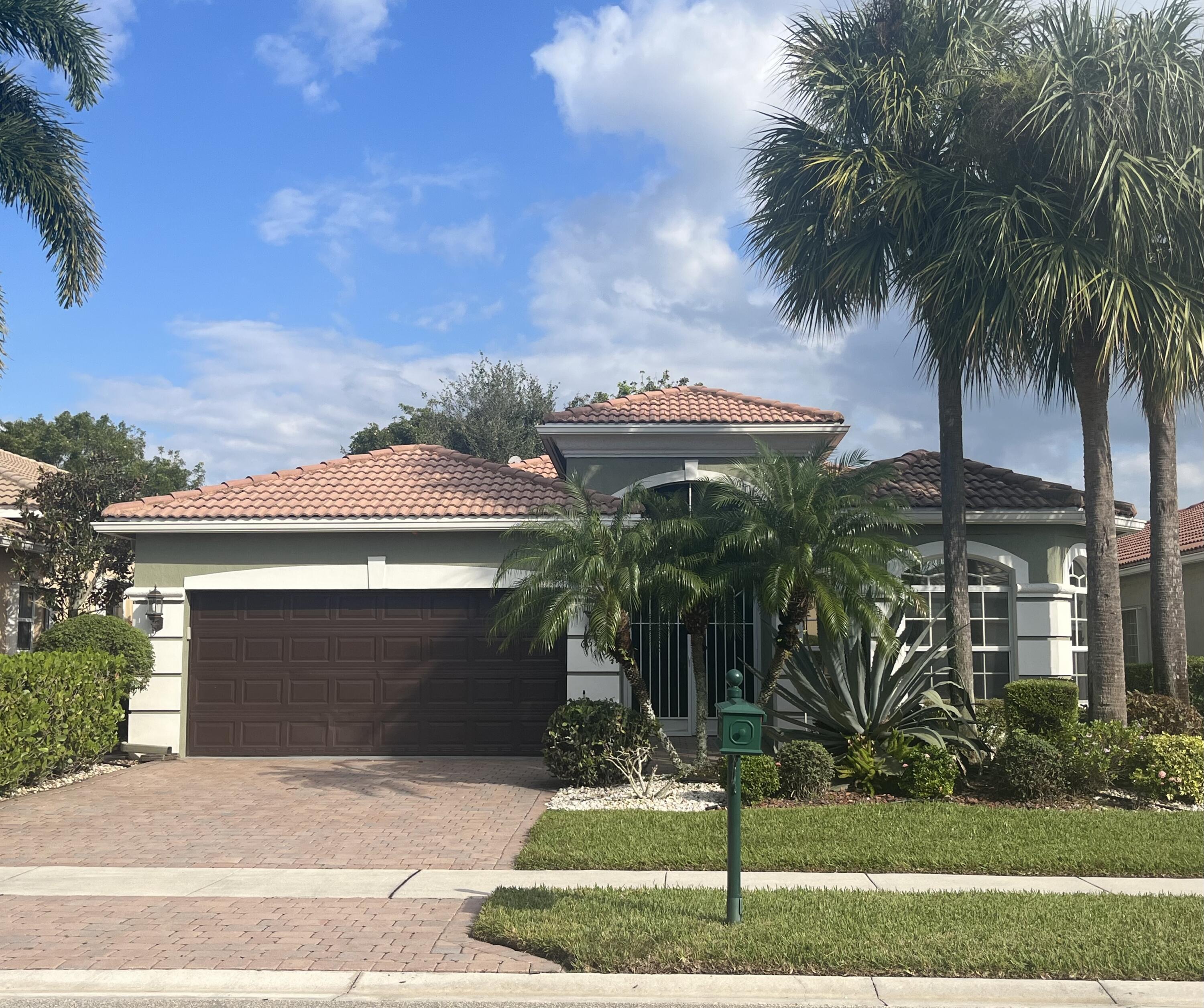 a front view of a house with yard