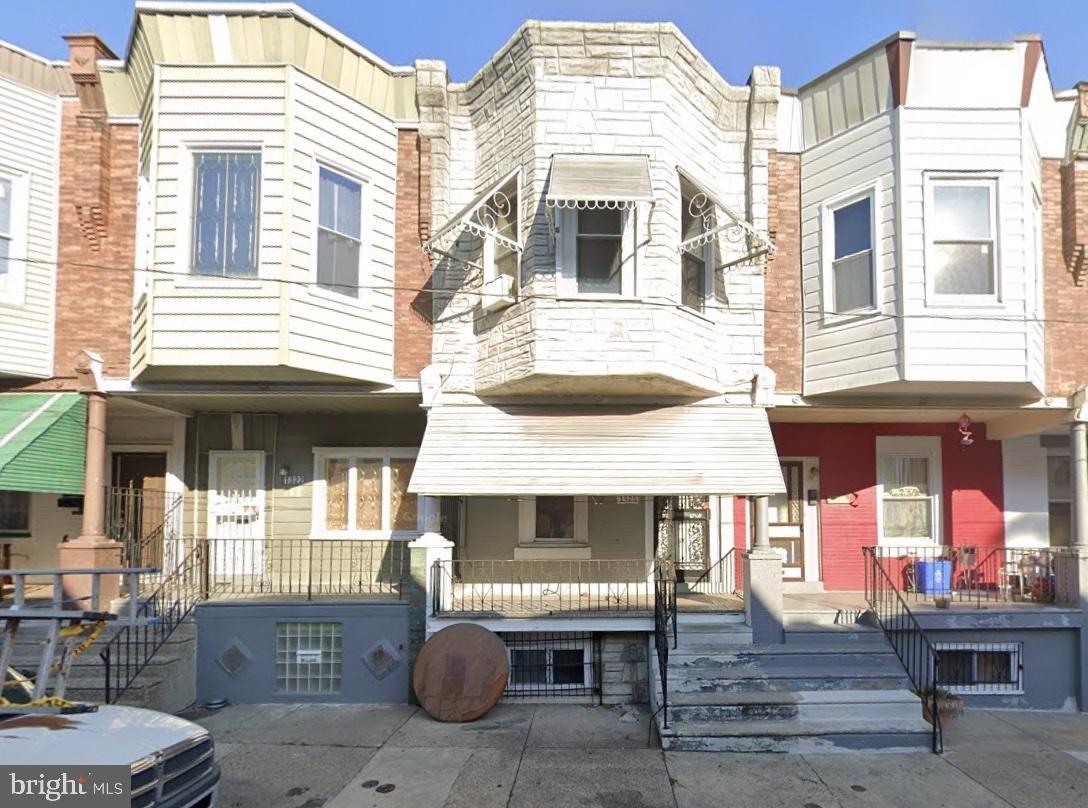 a front view of a house with a porch