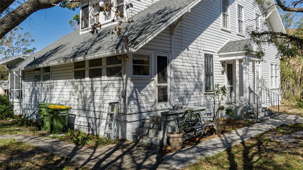 a front view of a house with outdoor seating