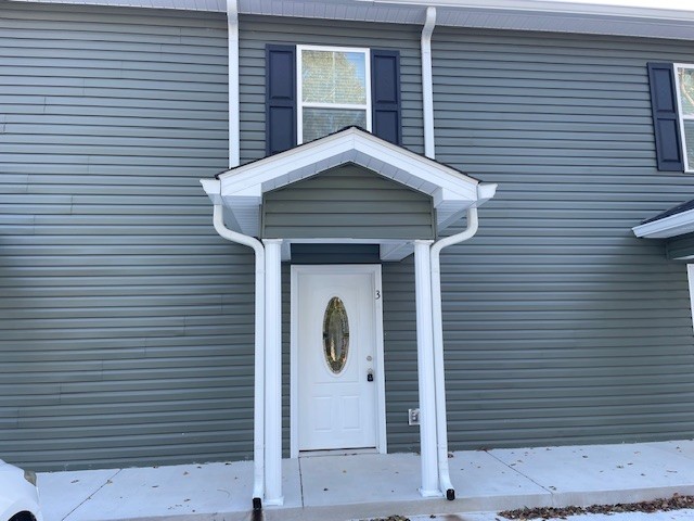 a front view of a house with garage