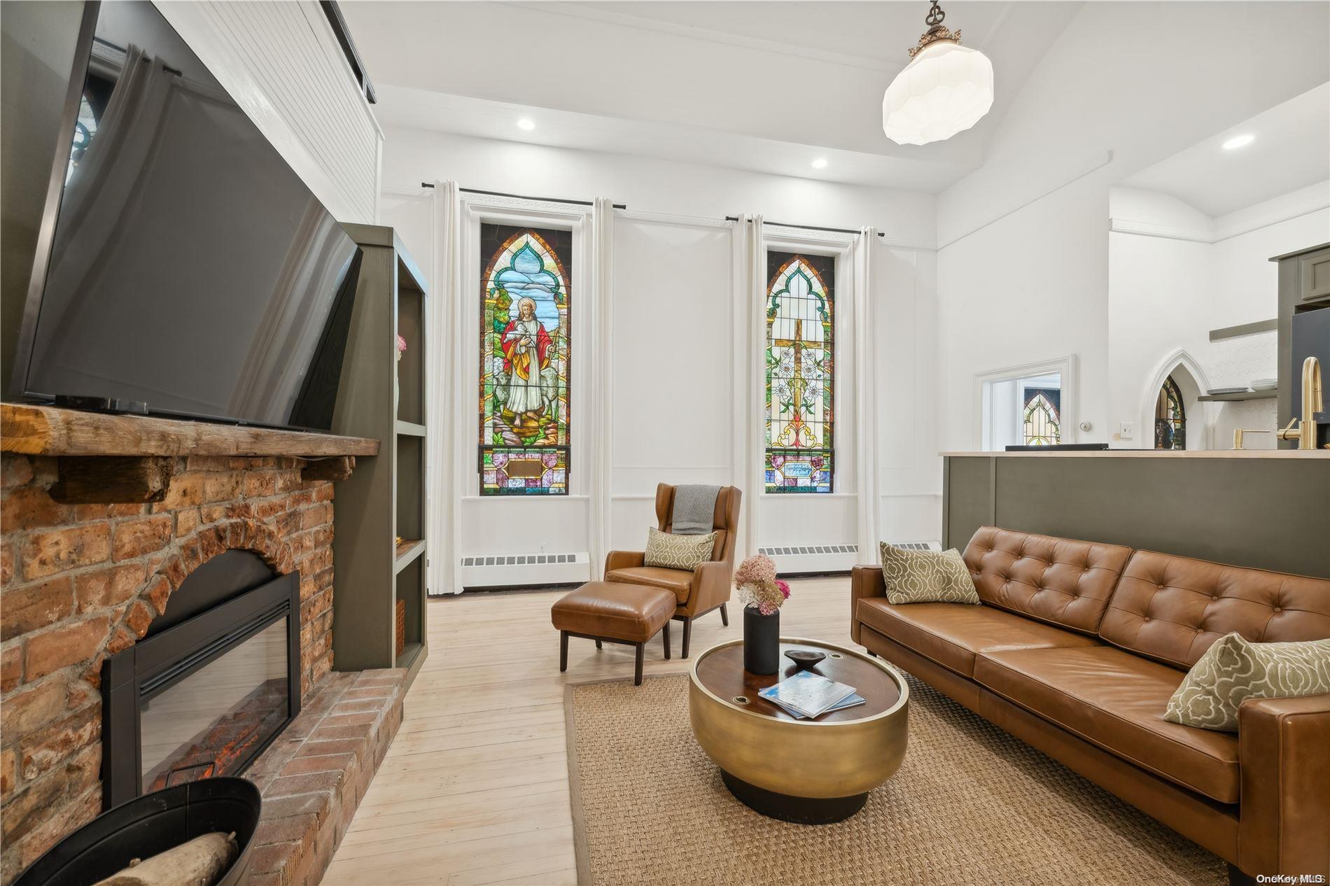 a living room with furniture and a fireplace