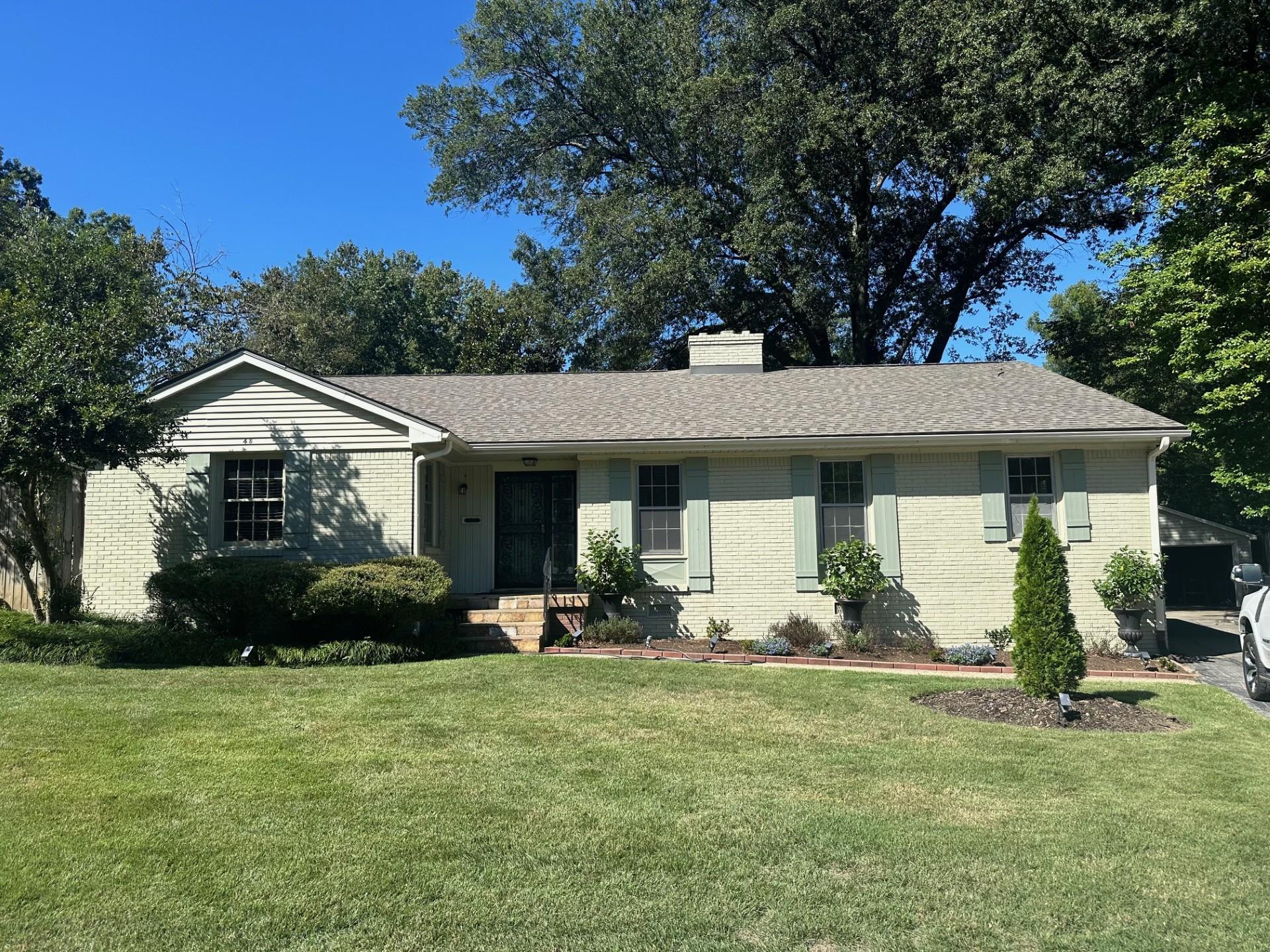 Ranch-style home featuring a front yard