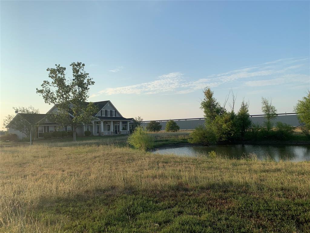 a view of a lake with houses in background