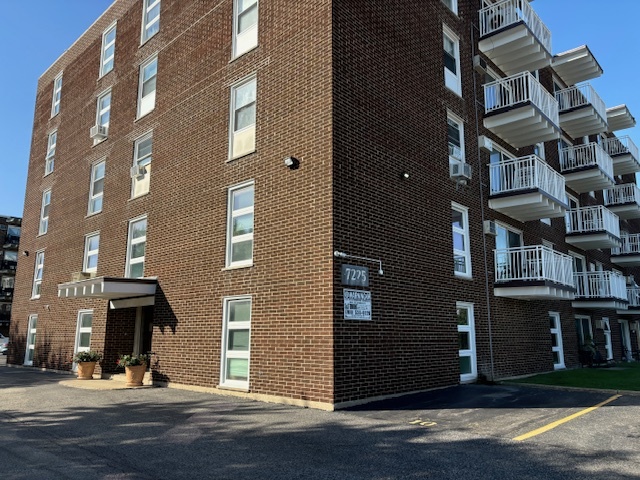 a view of a building with a street