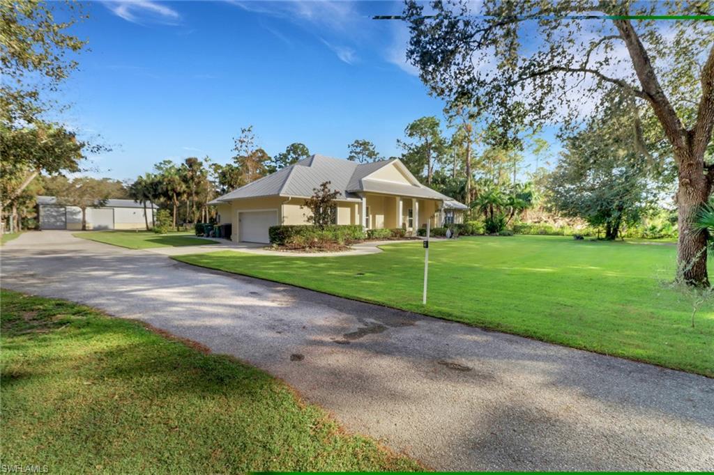 a view of a house with a big yard