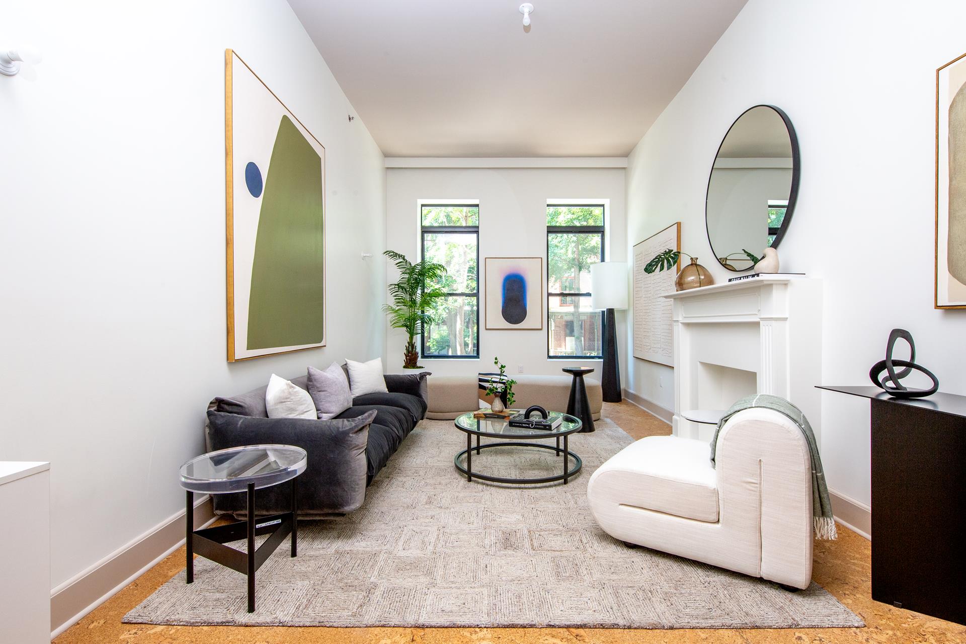 a living room with furniture a fireplace and a table