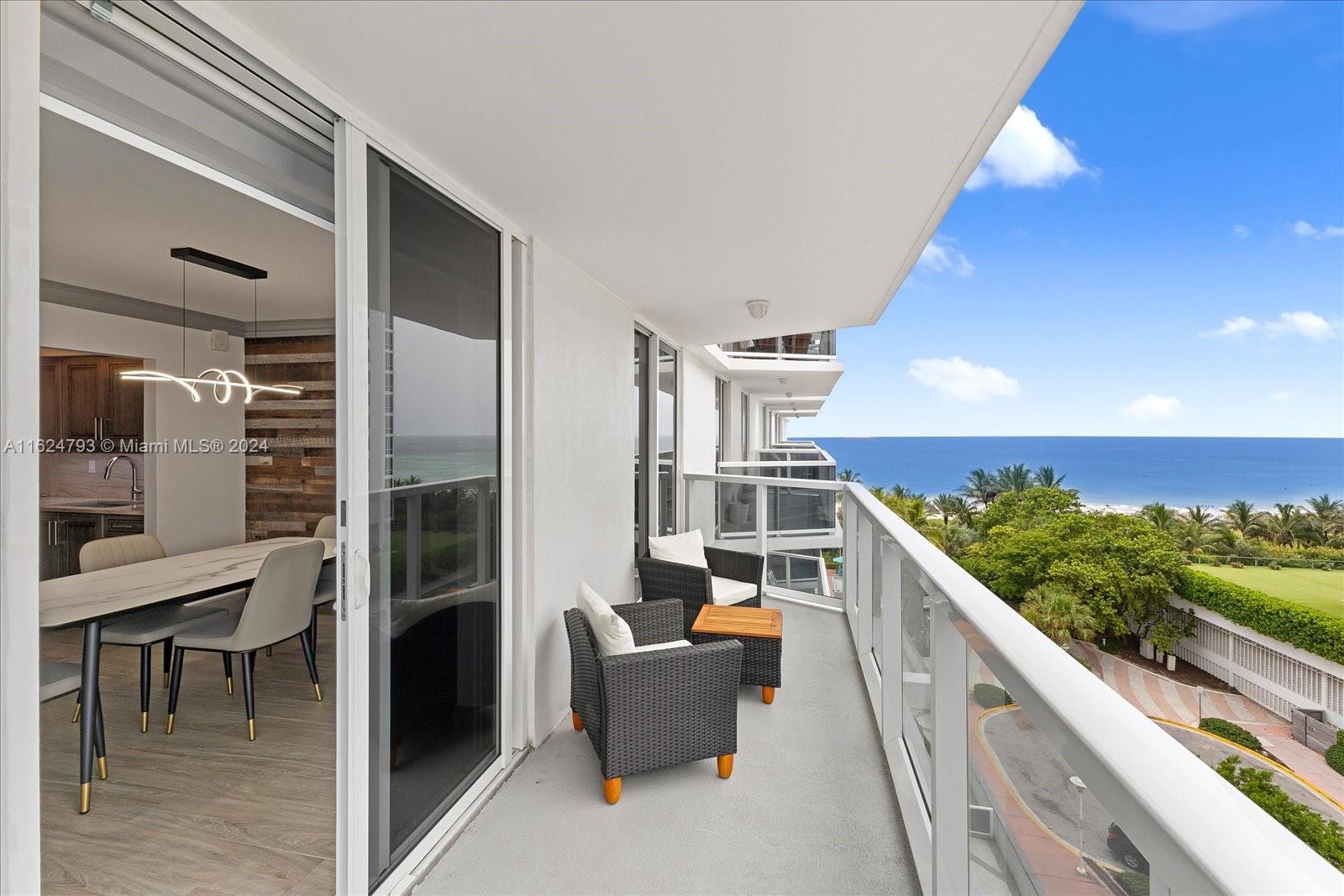 a balcony with furniture and city view