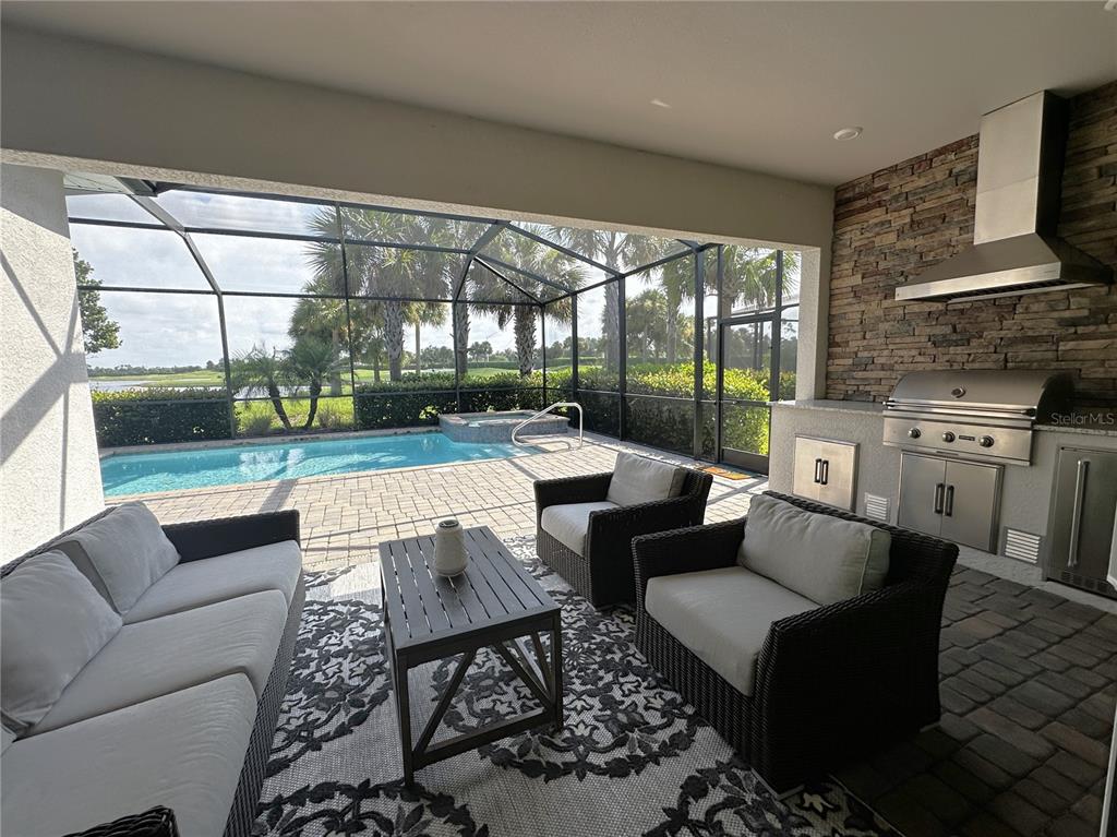 a outdoor living space with furniture and a floor to ceiling window