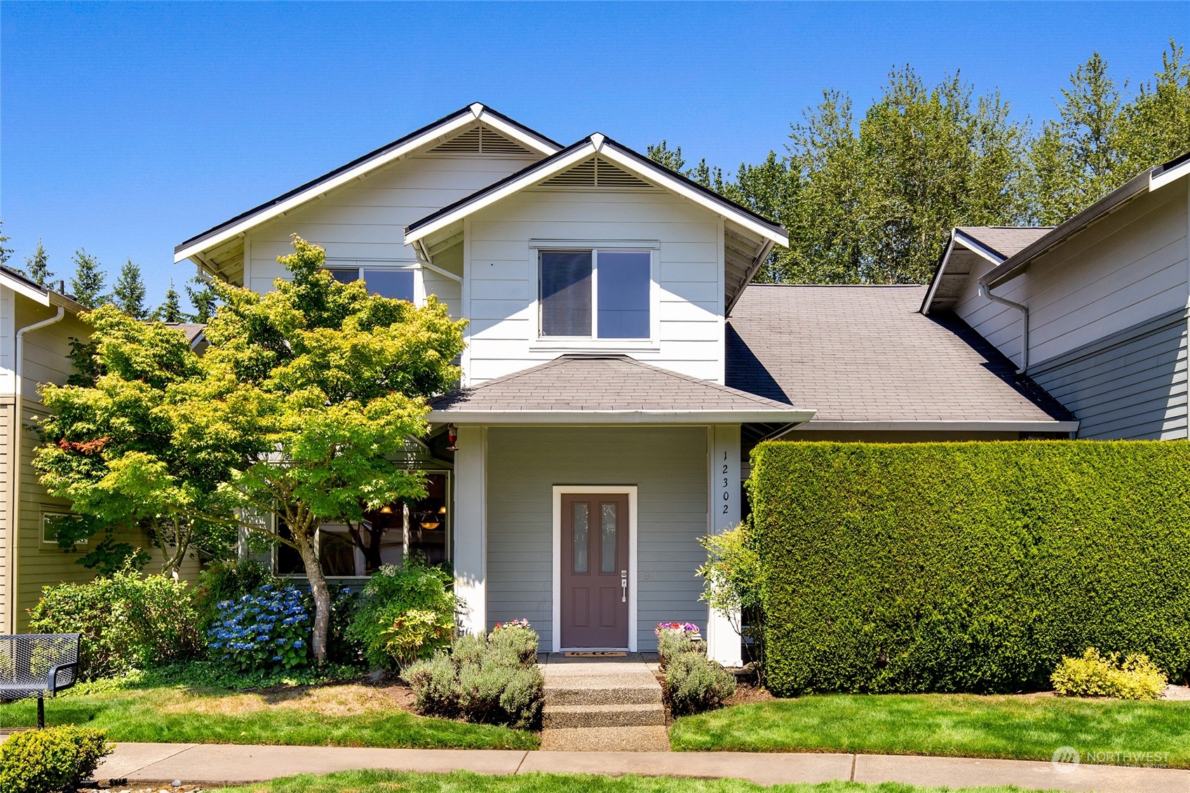 a front view of a house with garden