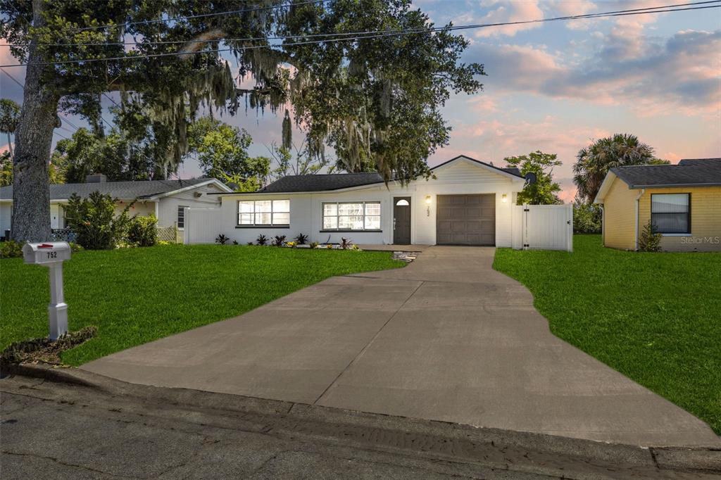 front view of a house with a yard