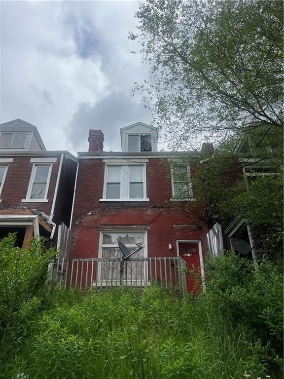 an aerial view of house with yard