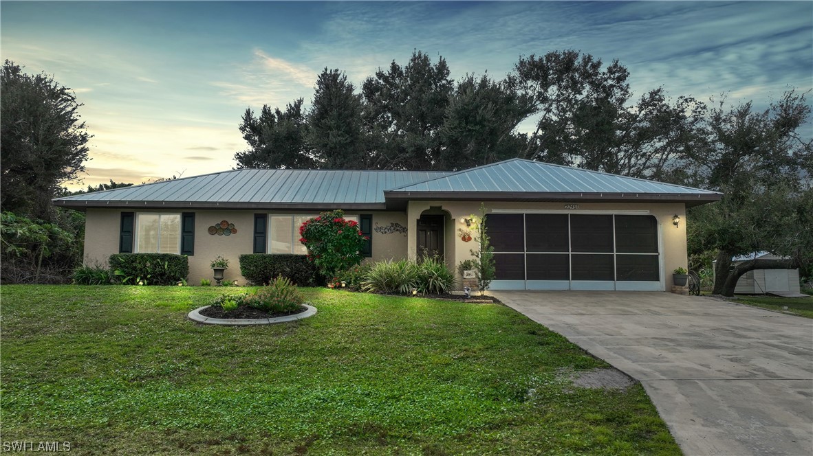 a front view of a house with a yard and porch