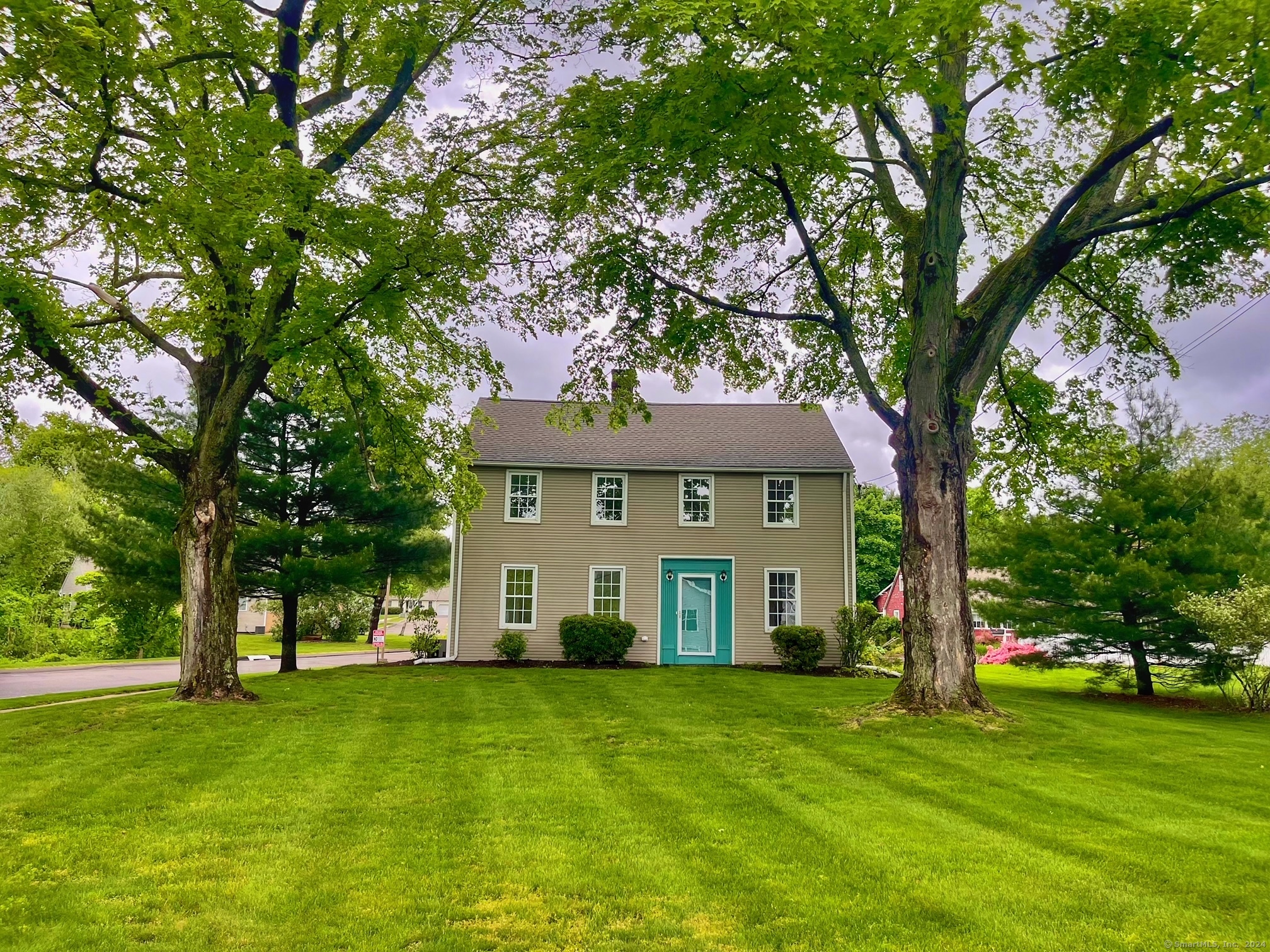 a view of a house with a yard