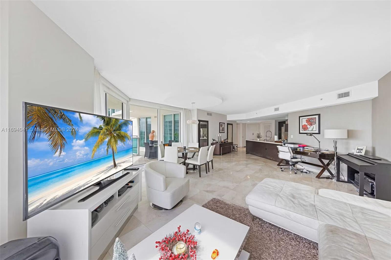 a living room with furniture and a flat screen tv