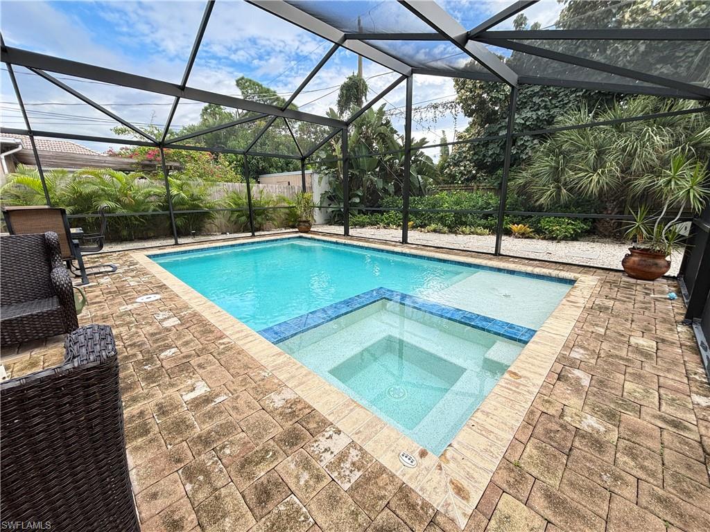 a view of a backyard balcony with a swimming pool